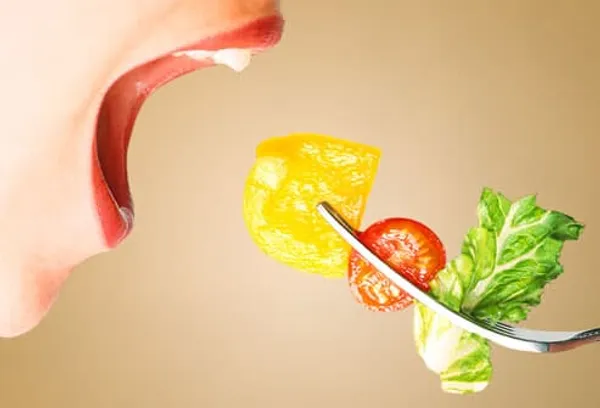 getty_rm_photo_of_woman_eating_veggies